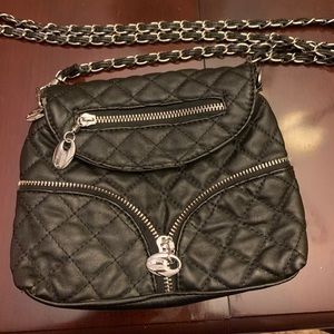 Crossbody quilted purse with chain straps.